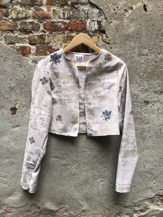 A Vintage-Inspired Cropped Jacket with Intricate Embroidery