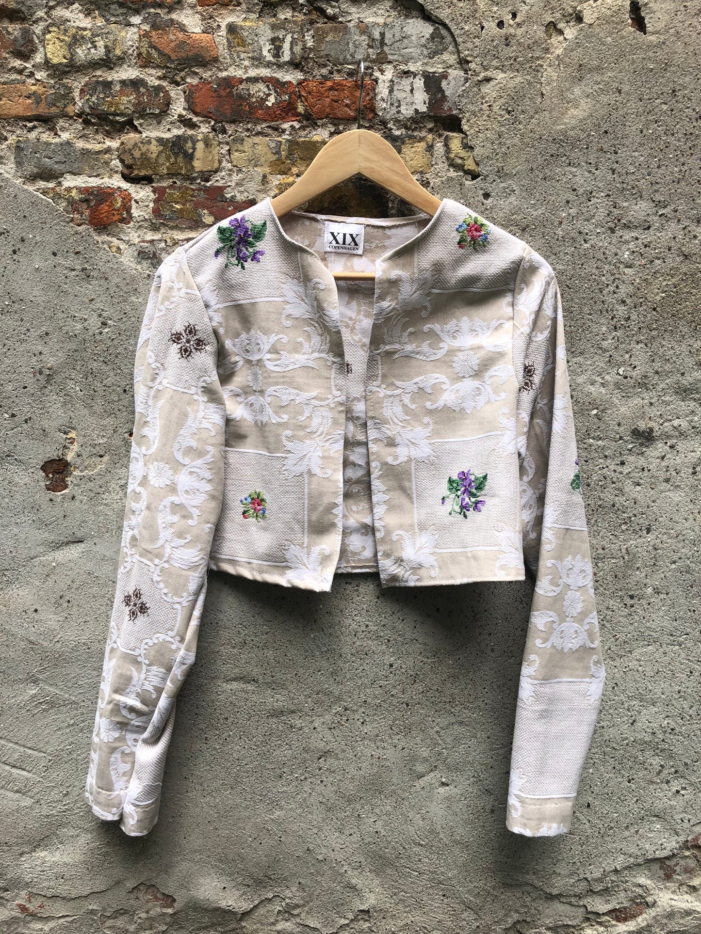 A Vintage-Inspired Cropped Jacket with Intricate Embroidery